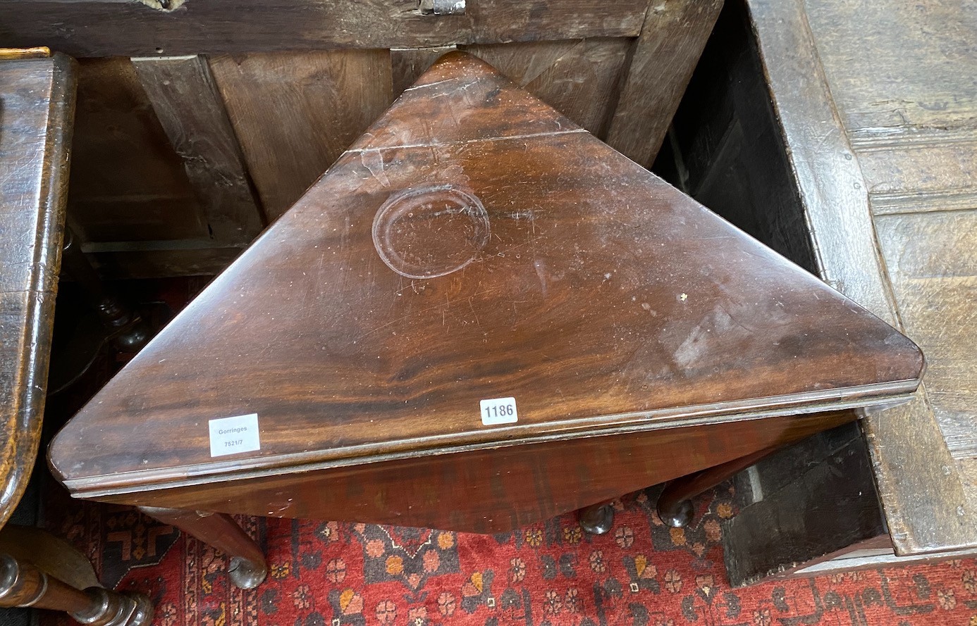 A 19th century triangular folding mahogany pad foot occasional table, width 79cm, depth 43cm, height 71cm